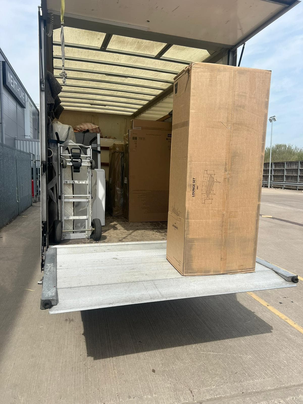Professional furniture removal team loading a van in the Cotswolds